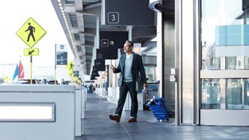 travel-accident-insurance-800x450 man walking out of airport